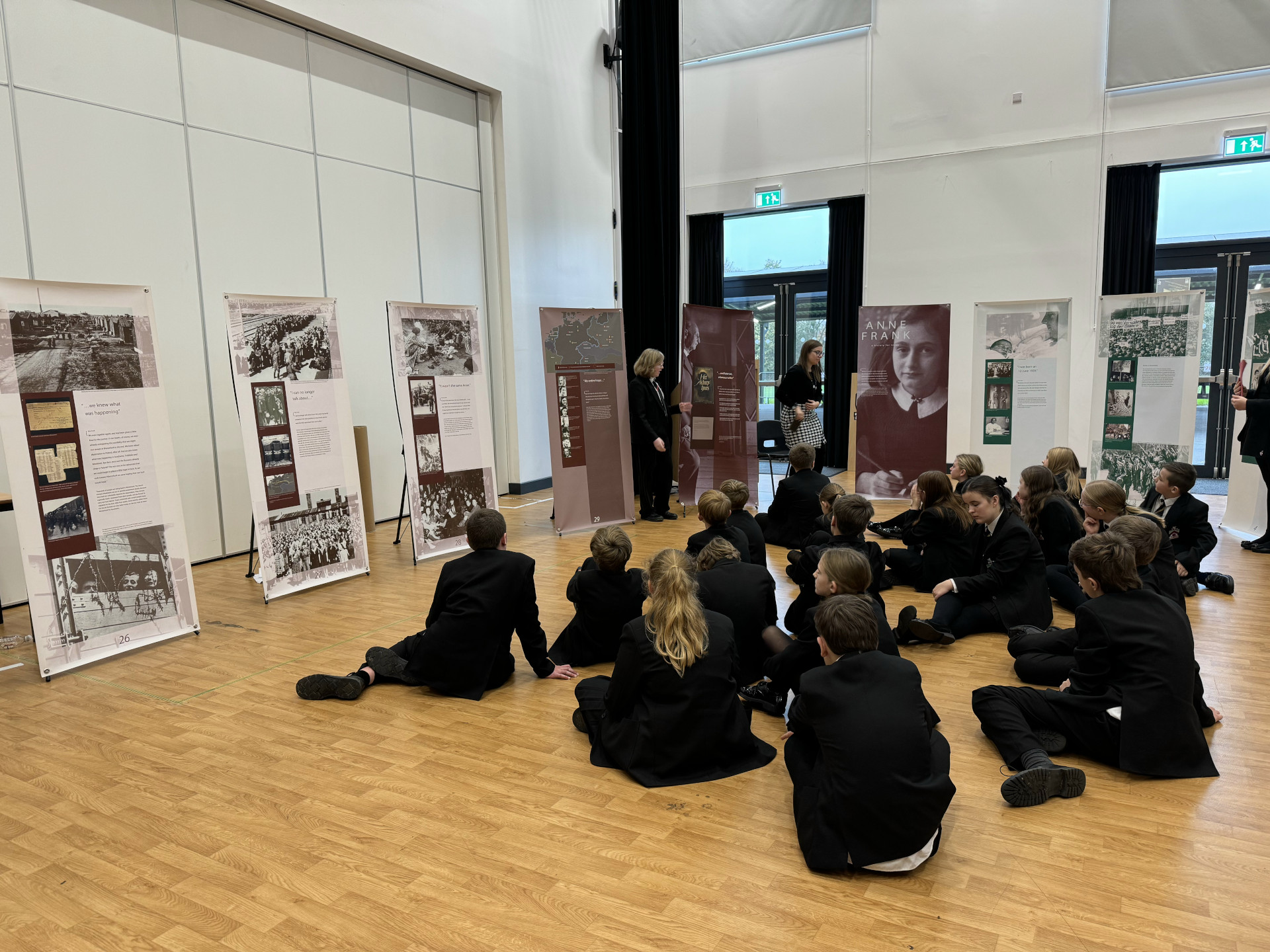 Students helping to host an exhibit by the Anne Frank Trust Museum.