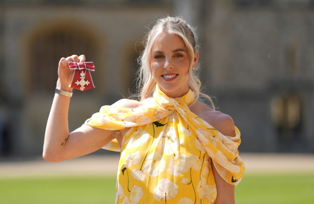 Caption: Keely Hodgkinson at the presentation of her Member of the Order of the British Empire (MBE).